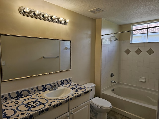 9833 Baywinds Dr Unit 7307, West Palm Beach, FL 33411 - bathroom featuring vanity, shower / washtub combination, tile patterned floors, and a textured ceiling