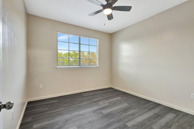 empty room with ceiling fan, baseboards, and dark wood finished floors