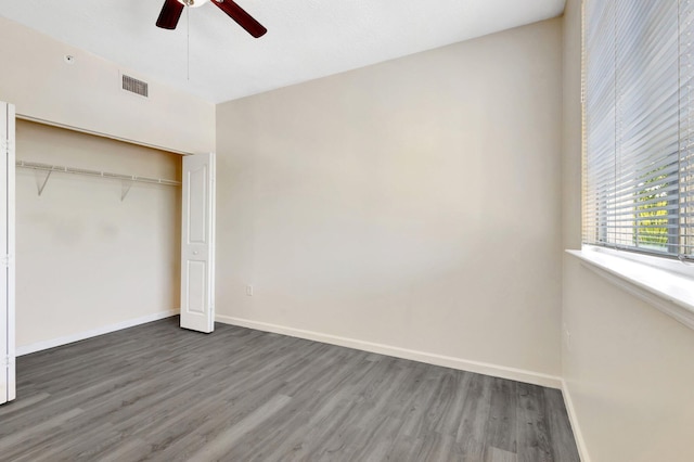 9833 Baywinds Dr Unit 7307, West Palm Beach, FL 33411 - unfurnished bedroom featuring wood finished floors, a closet, and a ceiling fan