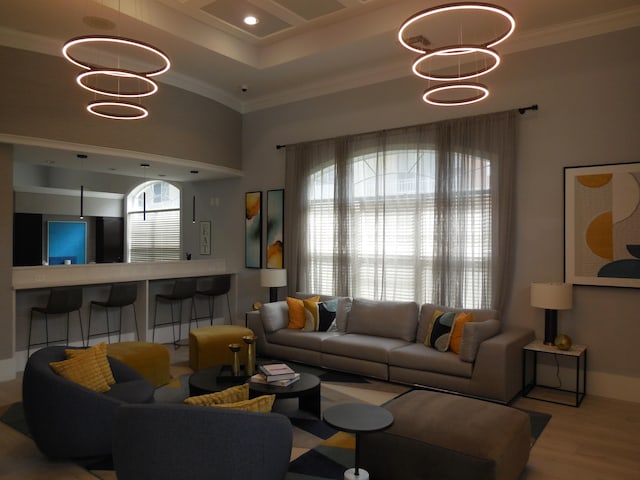 living room featuring recessed lighting, wood finished floors, baseboards, and ornamental molding