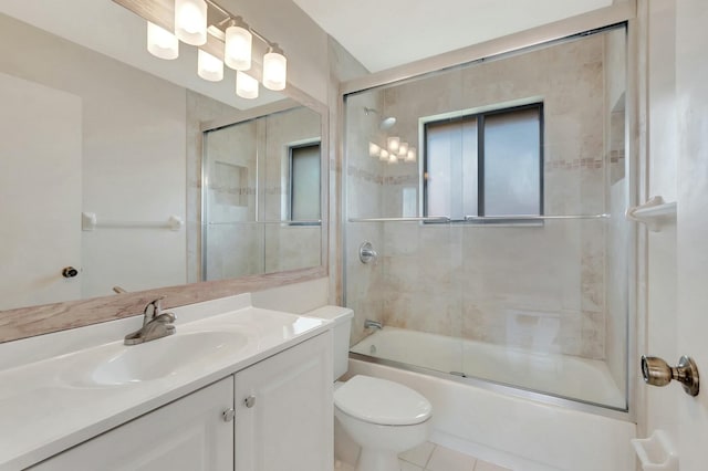 full bathroom with enclosed tub / shower combo, tile patterned floors, toilet, and vanity