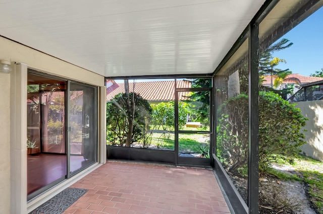 unfurnished sunroom with plenty of natural light