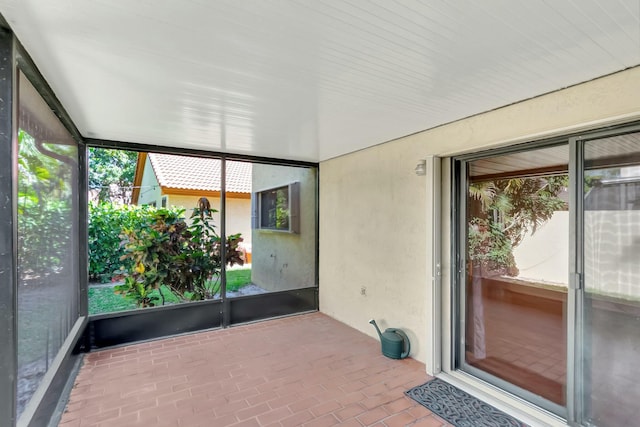 unfurnished sunroom with plenty of natural light