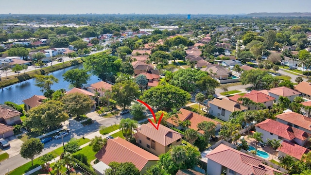 bird's eye view with a residential view and a water view