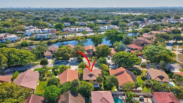 bird's eye view with a residential view and a water view