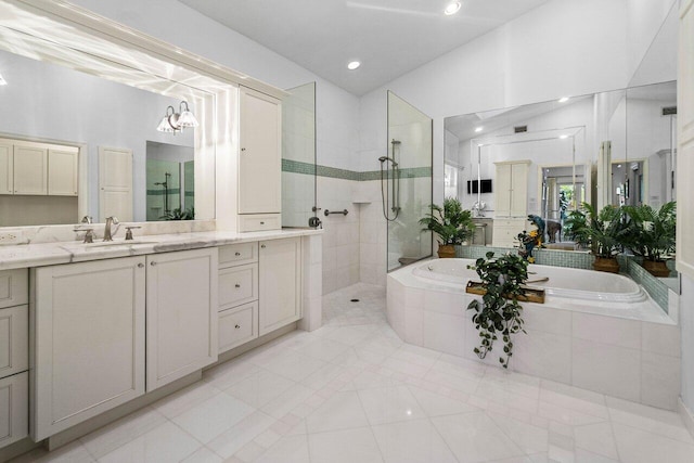 full bath with tile patterned floors, a walk in shower, lofted ceiling, a bath, and vanity