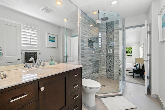 full bath featuring visible vents, toilet, a stall shower, and vanity