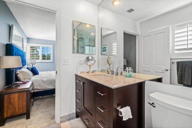 full bathroom featuring visible vents, a textured ceiling, ensuite bath, and toilet