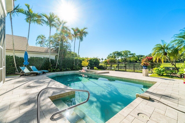 view of pool featuring a fenced in pool, a patio, and fence