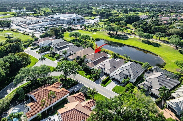 aerial view featuring view of golf course, a residential view, and a water view