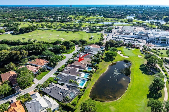 aerial view with a residential view, golf course view, and a water view