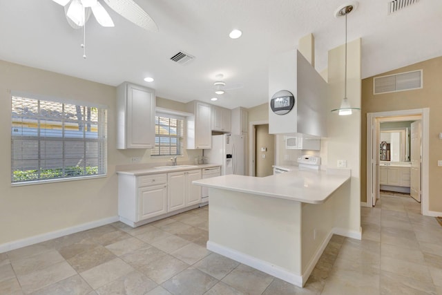 kitchen featuring visible vents, white cabinets, white appliances, and light countertops