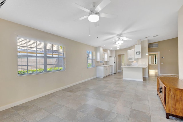 unfurnished living room with lofted ceiling, baseboards, visible vents, and ceiling fan