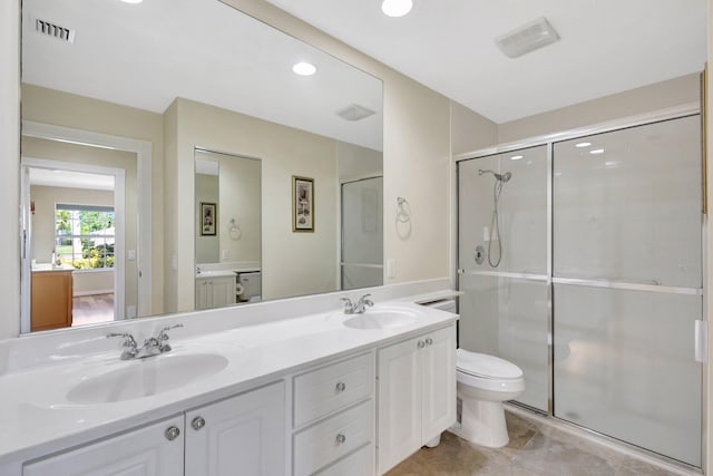 full bath with visible vents, a shower stall, and a sink