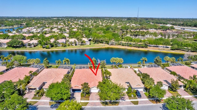 birds eye view of property featuring a residential view and a water view