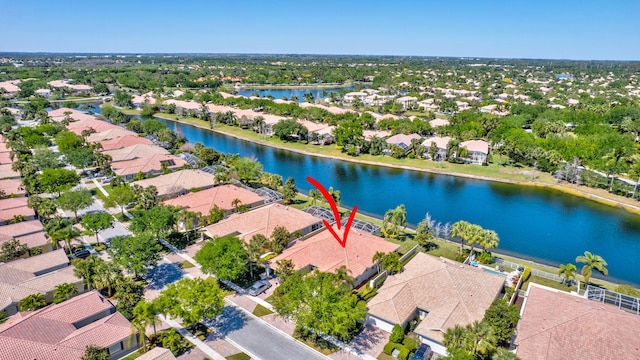 bird's eye view featuring a residential view and a water view