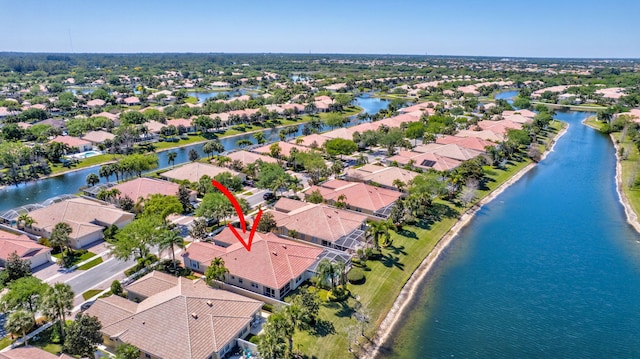 aerial view featuring a residential view and a water view