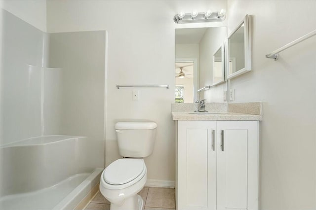 bathroom featuring tile patterned floors, toilet, a shower, baseboards, and vanity