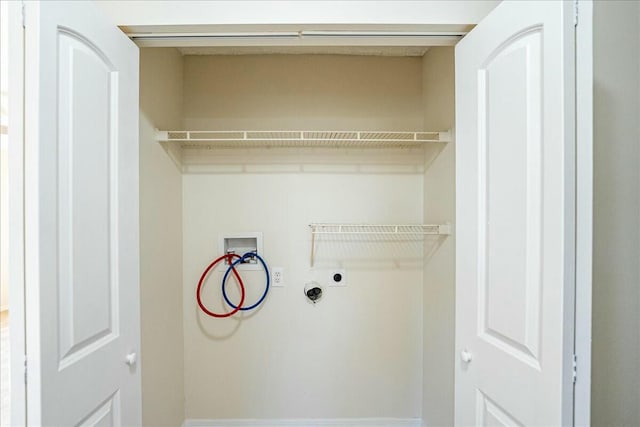 clothes washing area with hookup for an electric dryer, washer hookup, and laundry area