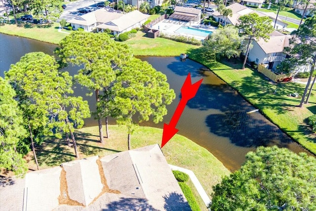 drone / aerial view featuring a water view and a residential view