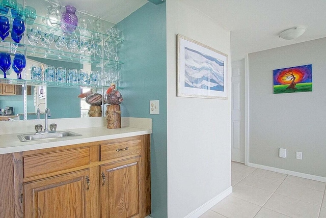 bathroom featuring tile patterned floors, vanity, and baseboards