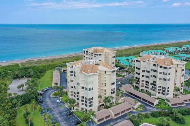 bird's eye view with a water view and a view of the beach