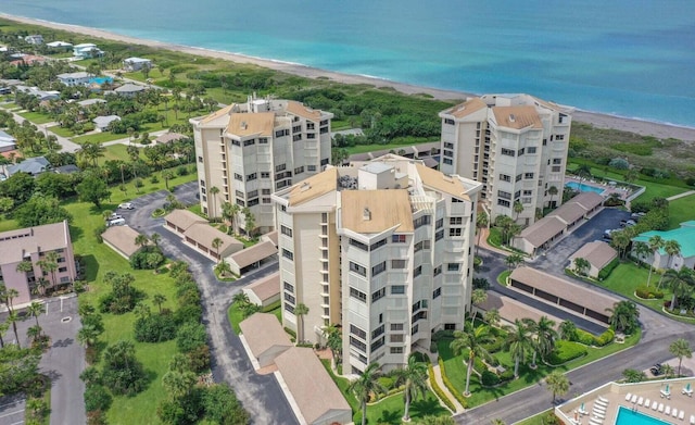 drone / aerial view with a view of the beach and a water view