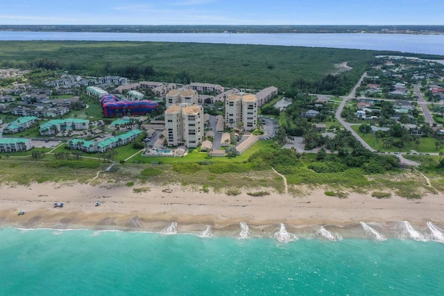 drone / aerial view featuring a view of the beach and a water view