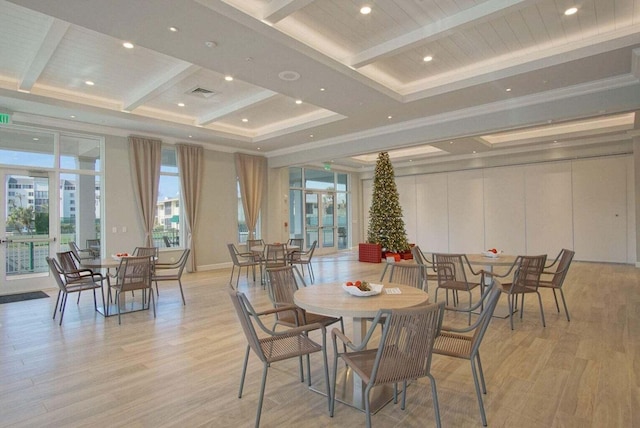 dining room with beam ceiling, plenty of natural light, french doors, and light wood-type flooring