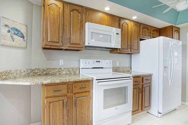 kitchen featuring recessed lighting, brown cabinets, light tile patterned flooring, white appliances, and a ceiling fan