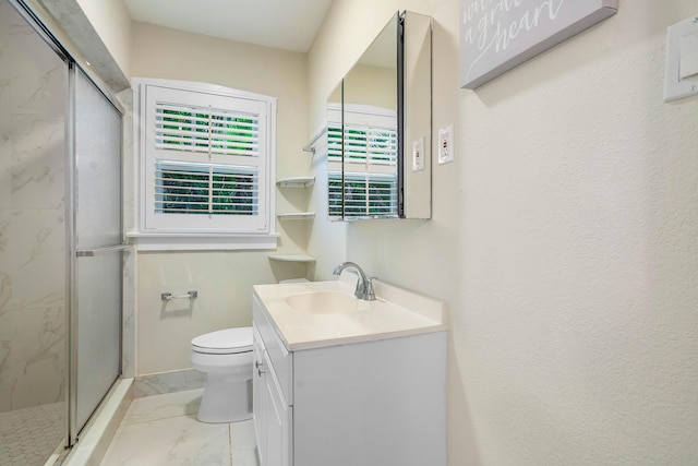 bathroom with a marble finish shower, toilet, marble finish floor, and vanity