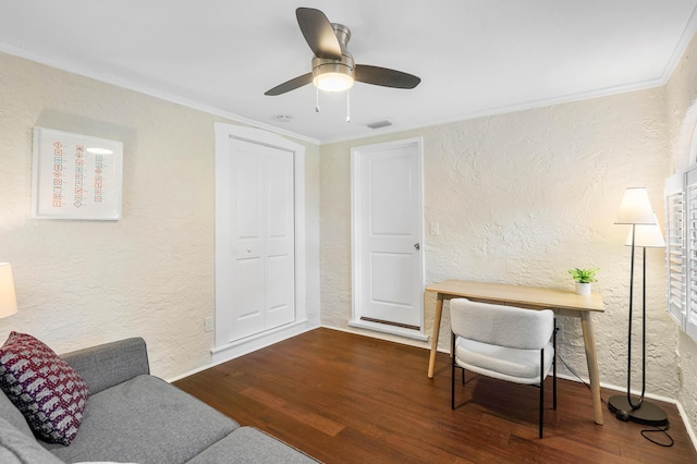 office space featuring wood finished floors, crown molding, and a textured wall