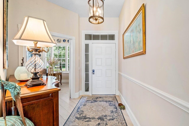 396 Kelsey Park Dr, Palm Beach Gardens, FL 33410 - entrance foyer with an inviting chandelier and baseboards