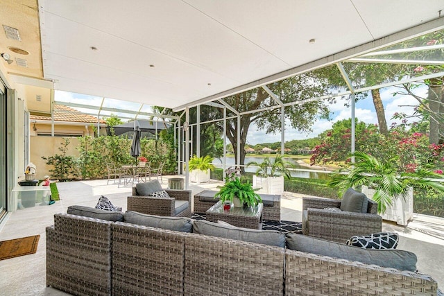 396 Kelsey Park Dr, Palm Beach Gardens, FL 33410 - view of patio / terrace with a water view, glass enclosure, outdoor lounge area, and visible vents