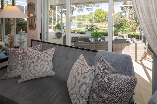 sunroom with a water view