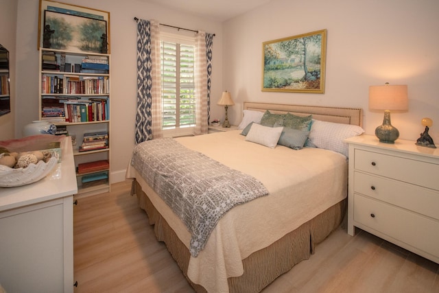 bedroom featuring light wood finished floors