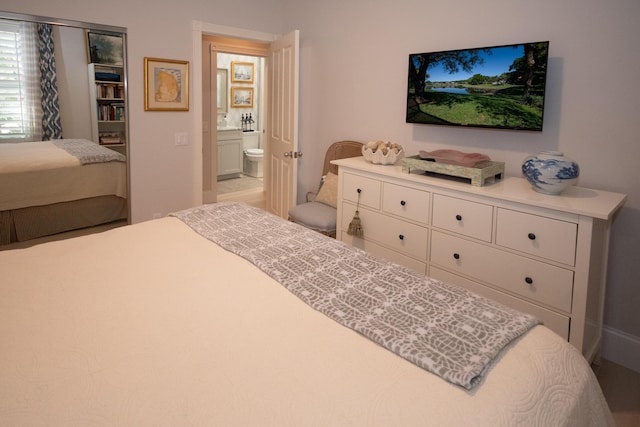 bedroom featuring ensuite bath