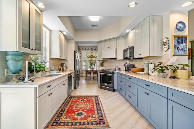 396 Kelsey Park Dr, Palm Beach Gardens, FL 33410 - kitchen featuring decorative backsplash, visible vents, custom range hood, a sink, and stainless steel appliances