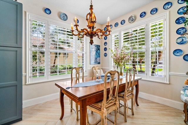 396 Kelsey Park Dr, Palm Beach Gardens, FL 33410 - dining space featuring baseboards and a notable chandelier