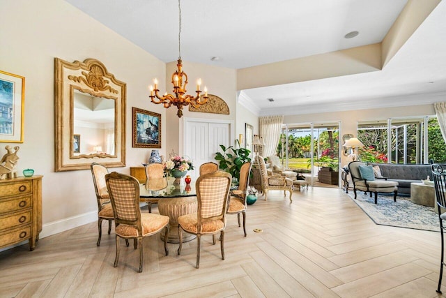 396 Kelsey Park Dr, Palm Beach Gardens, FL 33410 - dining space featuring baseboards, a notable chandelier, plenty of natural light, and ornamental molding