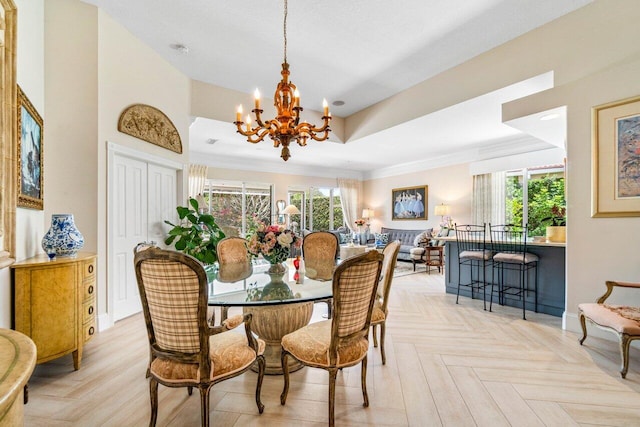 396 Kelsey Park Dr, Palm Beach Gardens, FL 33410 - dining area featuring crown molding, baseboards, a tray ceiling, and a chandelier