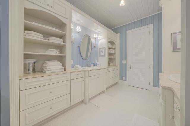 full bathroom featuring vanity, a closet, and ornamental molding