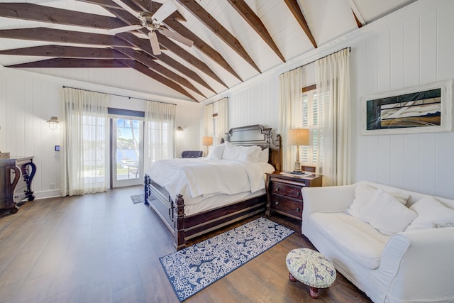 bedroom with access to outside, wood finished floors, vaulted ceiling with beams, and multiple windows