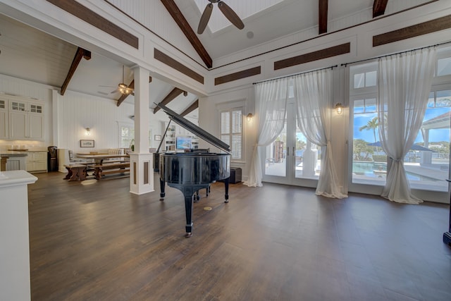 sitting room with ceiling fan, french doors, and beamed ceiling