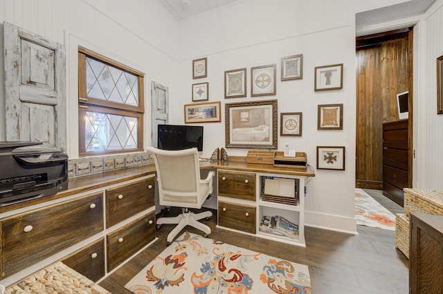 office space featuring baseboards and dark wood-type flooring