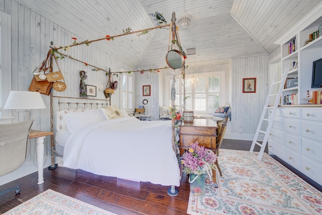 bedroom with lofted ceiling, wooden walls, wood finished floors, and wood ceiling