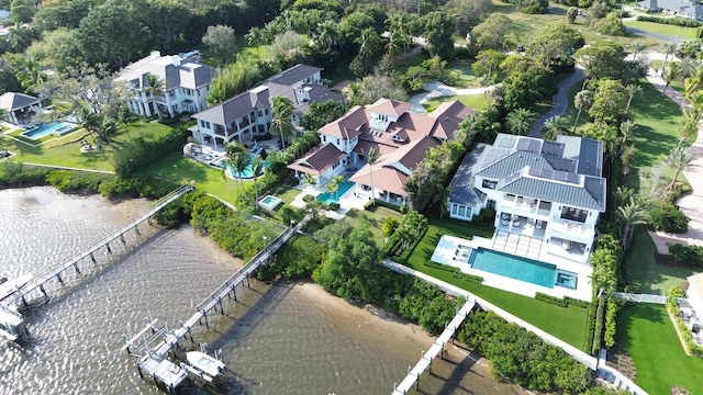 birds eye view of property featuring a water view and a residential view