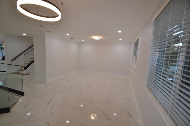 interior space featuring recessed lighting, baseboards, marble finish floor, and ornamental molding