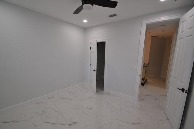 unfurnished bedroom featuring recessed lighting, visible vents, marble finish floor, and baseboards