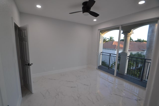 spare room featuring a ceiling fan, recessed lighting, baseboards, and marble finish floor